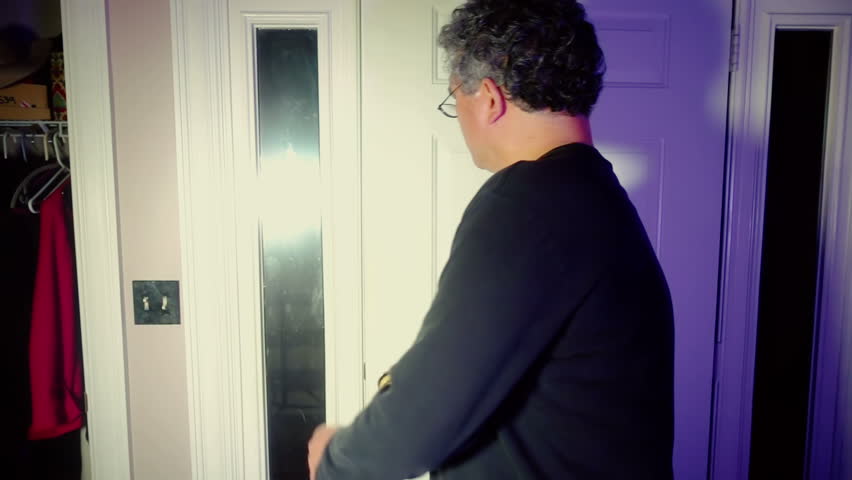 Man leaving a house through the front door