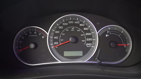 A car starts and needlese on dashboard.
