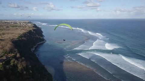 Paraglider in the air aerial shot.
