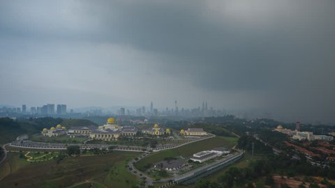 Time lapse: Dramatic monsoon season aerial view of the Kuala Lumpur skyline and the Malaysia national palace at twilight with lightning strikes. Prores Full HD 1080p. 4K available.