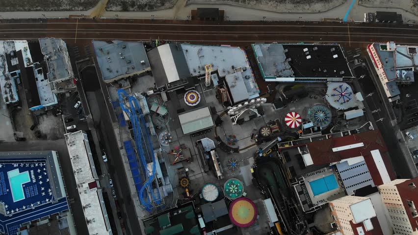 Aerial Drone Flying Over Ocean City New Jersey Boardwalk Rides, Ferris Wheel, Play Land, Looking Down On Town  