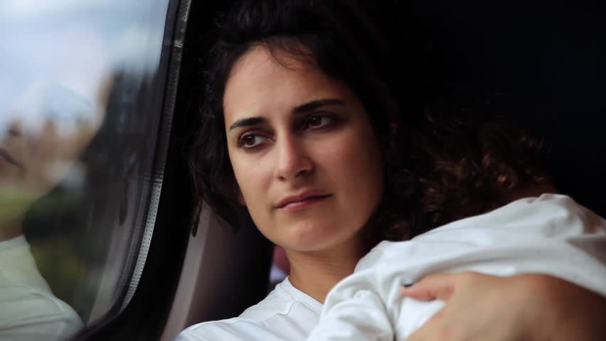 Close-up Portrait of a mother and her little daughter traveling with train