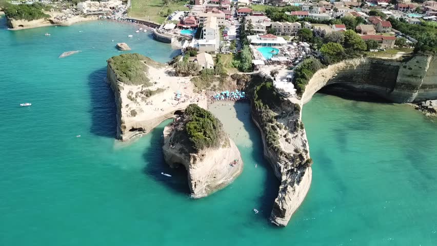 Aerial drone bird's eye view video of iconic white rock volcanic formations of Canal d' Amour in Sidari area, North Corfu island, Ionian, Greece
