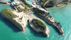 Aerial drone bird's eye view video of iconic white rock volcanic formations of Canal d' Amour in Sidari area, North Corfu island, Ionian, Greece