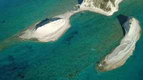 Aerial drone bird's eye view video of iconic white rock volcanic formations with emerald clear water near Canal d' Amour in Sidari area, North Corfu island, Ionian, Greece