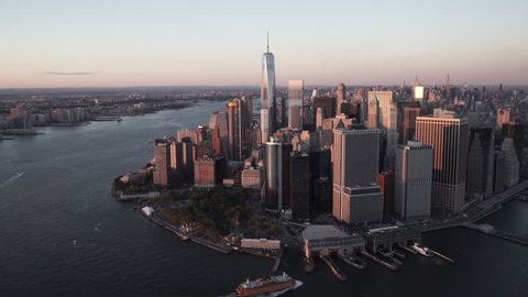 New York City Circa-2015, daytime aerial view of Lower Manhattan and the Staten Island Ferry from the East River