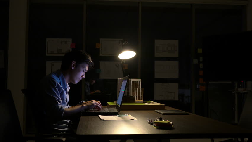 Employee man hard working with laptop to late night at office. Business people work overtime. Concept of relaxation is not enough. Royalty-Free Stock Footage #1016995828