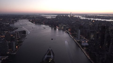 New York City Circa-2015, Aerial view of New York's skyline at dusk from above Roosevelt Island, featuring Midtown and Lower Manhattan, Long Island City and Brooklyn