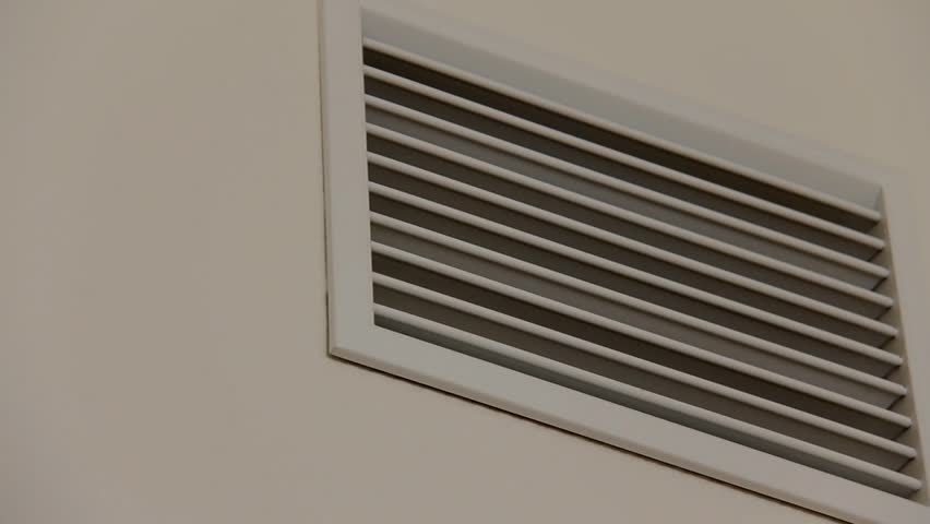 Plastic white ventilating grate on the beige painted wall Royalty-Free Stock Footage #1016999800