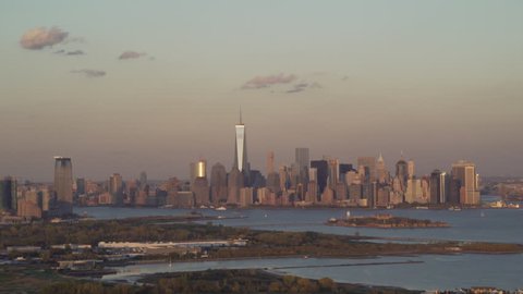 New York City Circa-2015, telephoto aerial view of Ellis Island Manhattan's skyline at sunset