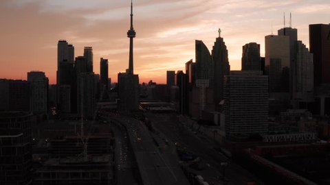Toronto, Ontario, Canada, aerial view of Toronto cityscape showing Downtown buildings and CN Tower during summer, At sunset