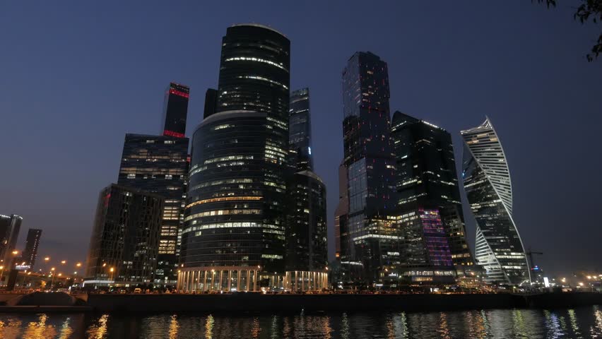 Panoramic view of Moscow city and Moskva River after sunset. New modern futuristic skyscrapers of Moscow-City - International Business Center | Shutterstock HD Video #1017011434