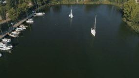 Aerial top view of a sailing yacht regatta. Flying over boats. 4k video
