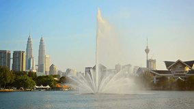 FullHD video - Beautiful. decorative fountain sprays water skyward from the surface of Titiwangsa Lake at a downtown park in Kuala Lumpur. Malaysia.