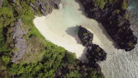 Drone shot aerial view of Idyllic Islands and lagoon in the Philippines with pristine clear water and turquoise colour; Travel vacation destination concept