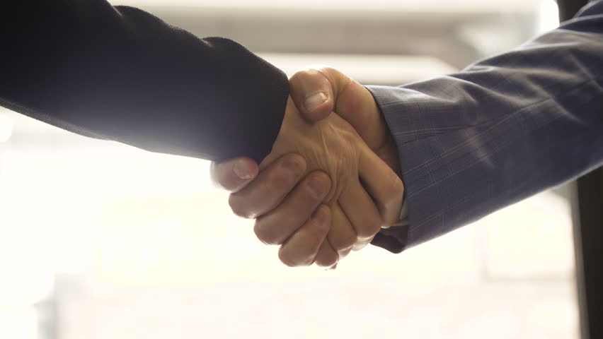 Close up of business man and woman shaking hands on deal greetings.  | Shutterstock HD Video #1017021283