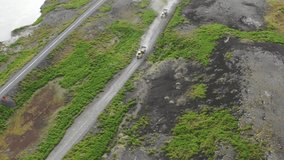 Aerial Video of Two Giant Yellow Dump Trucks Driving on Dirt Road
