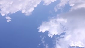 Beautiful blue skies, white time lapse clouds rolling in horizon, fluffy, puffy cloudscape panoramic aerial view, fast motion, clean nice sky.