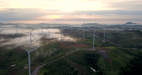 Landscape Wind Turbine, Aerial view sunrise from Drone flying Wind turbines produce electricity natural energy.