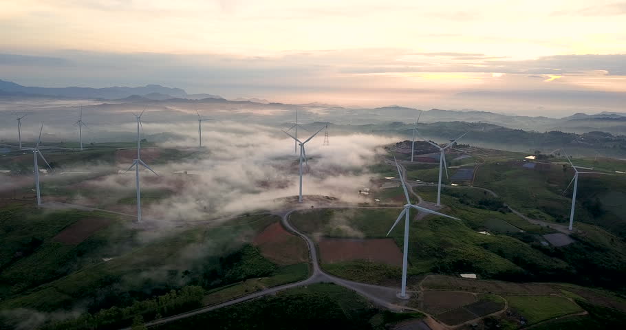 Clean Energy Wind Turbine, Aerial view sunrise from Drone flying Wind turbines produce electricity natural energy. | Shutterstock HD Video #1017030772