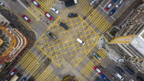 4k Zoom out hyperlapse of Urban Crossing road direct above in Day, Hong Kong