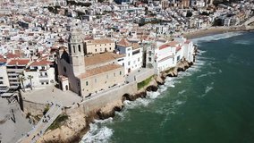 Panorama of coastal city of Sitges with building of church, Barcelona, Spain