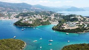 Aerial drone bird's eye view video of famous village and port in bay of Sivota, Epirus, Ionian, Greece