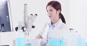 woman scientist look you and smile happily in laboratory