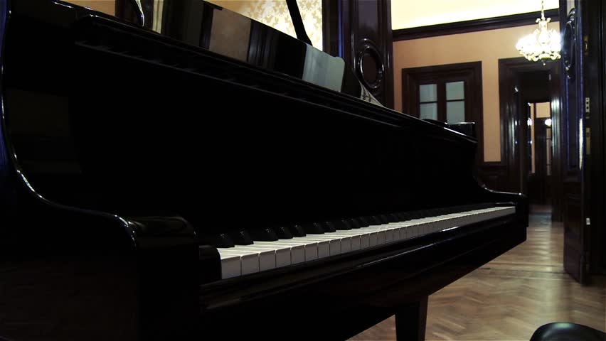 A Grand Piano in an Old Fashioned Room. Close Up. Zoom In. Royalty-Free Stock Footage #1017045364