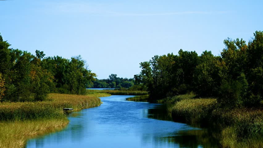 Mississippi River flows north toward Bemidji Minnesota near hiway 2. This scene is a few miles from the source at Lake Itasca