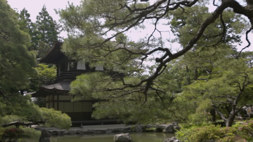 Wide shot of shrine and lake surrounded by trees, Kyoto City, Kyoto Prefecture, Japan