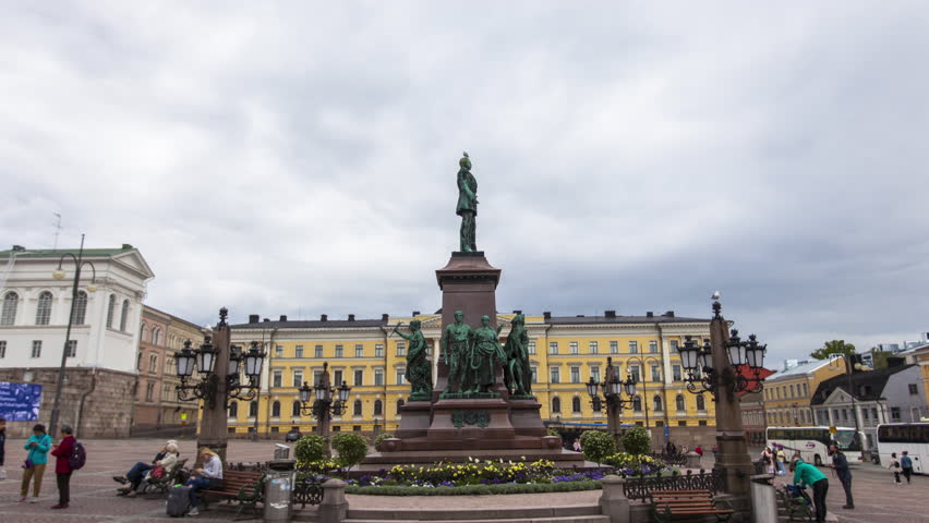 Wide shot of tourists visiting at Helsinki Senate Square and Helsinki Lutheran Cathedral, Helsinki, Finland