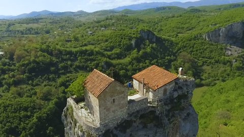 Katskhi Pillar with ancient church on top in Caucasian mountains in Georgia