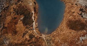 Aerial footage of lake Nesamovyte in Carpahtian mountains.Beautiful drone video of mountain park in Southern Europe.Travel destination for active tourist and hikers
