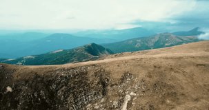 Aerial panorama footage of Carpathian mountain park in Western Ukraine.Beautiful drone video of Carpathians and green valley.Travel destination for hikers and active tourism in autumn season