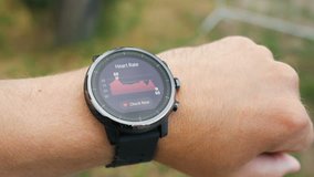Checking the heart rate by smart watch. Smartwatch. Touching screen. Pulse checking. heart rate monitor - Powered by Shutterstock - Get 15% off with code: PIKWIZARD15
