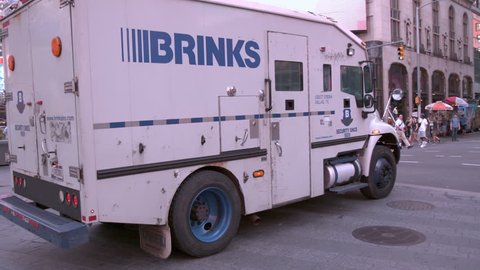 NEW YORK, NY - AUGUST 24: Brinks Security Truck driving through Times Square slow motion in New York City, New York on August 24, 2018.