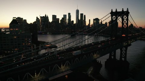 alt flying over Manhattan Bridge towards dusk view of NYC