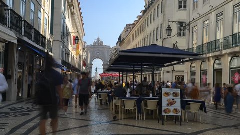Lisbon, Portugal - August 28, 2018: Time lapse at Augusta Street with the Triumphal Arch seen at the end of it connecting the most famous Lisbon street to Terreiro do Paco Square aka Praca do Comercio