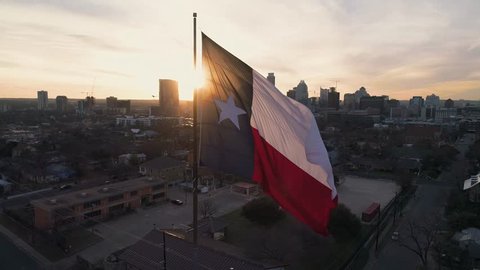 4K Texas Flag Orbit Aerial at Sunset - Austin