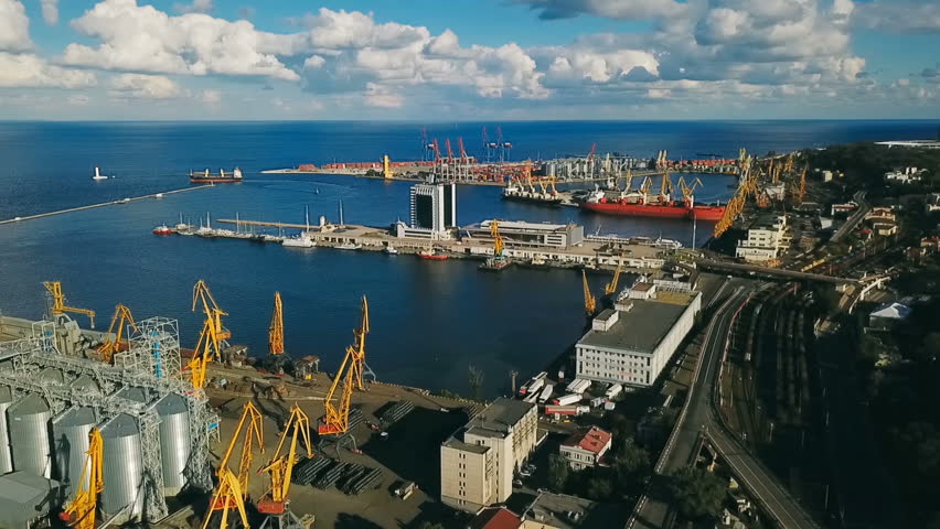 Balck sea port and city center in Odessa Ukraine. Eastern Europe. Aerial drone video footage. seaport crane industrial infrastructure. Black sea connection. Top view