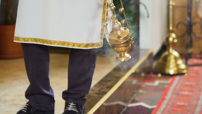 Slow motion footage of Catholic ritual Thurman in action and producing the smoke Royalty-Free Stock Footage #1017102265
