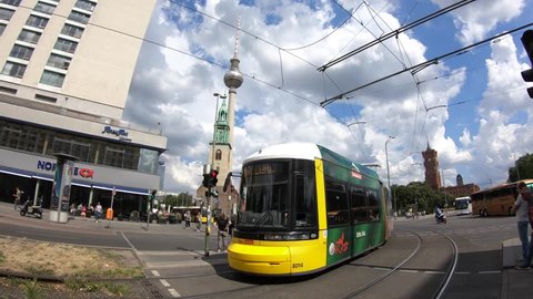 Berlin, Germany-11 July, 2018: 4K. The tram is passing near Rotes Rathaus (Red City Hall) in Berlin. Camera movement towards the Fernsehturm Television Tower-Adrian