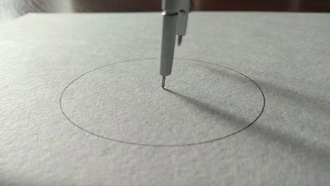 compasses draw a circle on a piece of paper