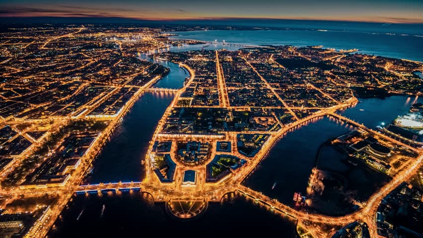 St. Petersburg, flight over the illuminated streets and canals to the bay in the evening