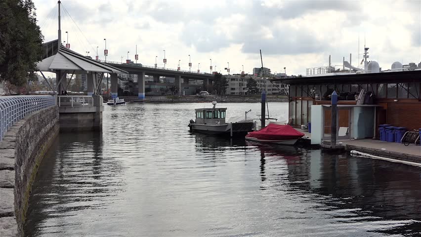 Yaletown Harbor boats of False Creek and Granville Bridge traffic in Vancouver City, British Columbia, West Canada, North America.