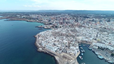 Aerial video. Old Town of Monopoli - city on Adriatic Sea. Province of Bari, region of Apulia. Italy. 4K
