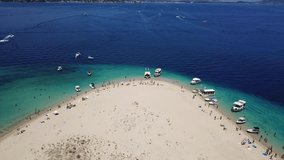 Aerial drone video from famous for Caretta caretta sea turtle haching, exotic small island of Marathonisi with white caves and sapphire sea and sandy beach , Zakynthos island, Ionian, Greece