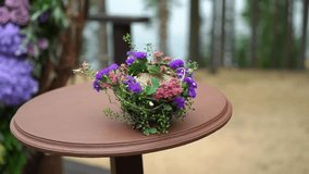 Wedding. Wedding ceremony. Arch, decorated with violet and yellow flowers standing in the woods, in the wedding ceremony area decoration - Powered by Shutterstock - Get 15% off with code: PIKWIZARD15