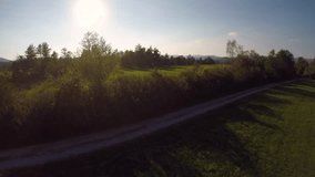 Aerial video of a woman running in the sun